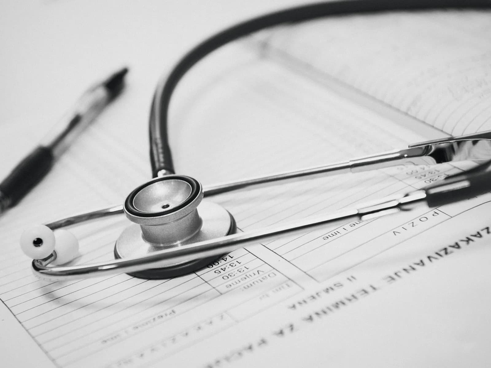 A stethoscope lying on medical paperwork