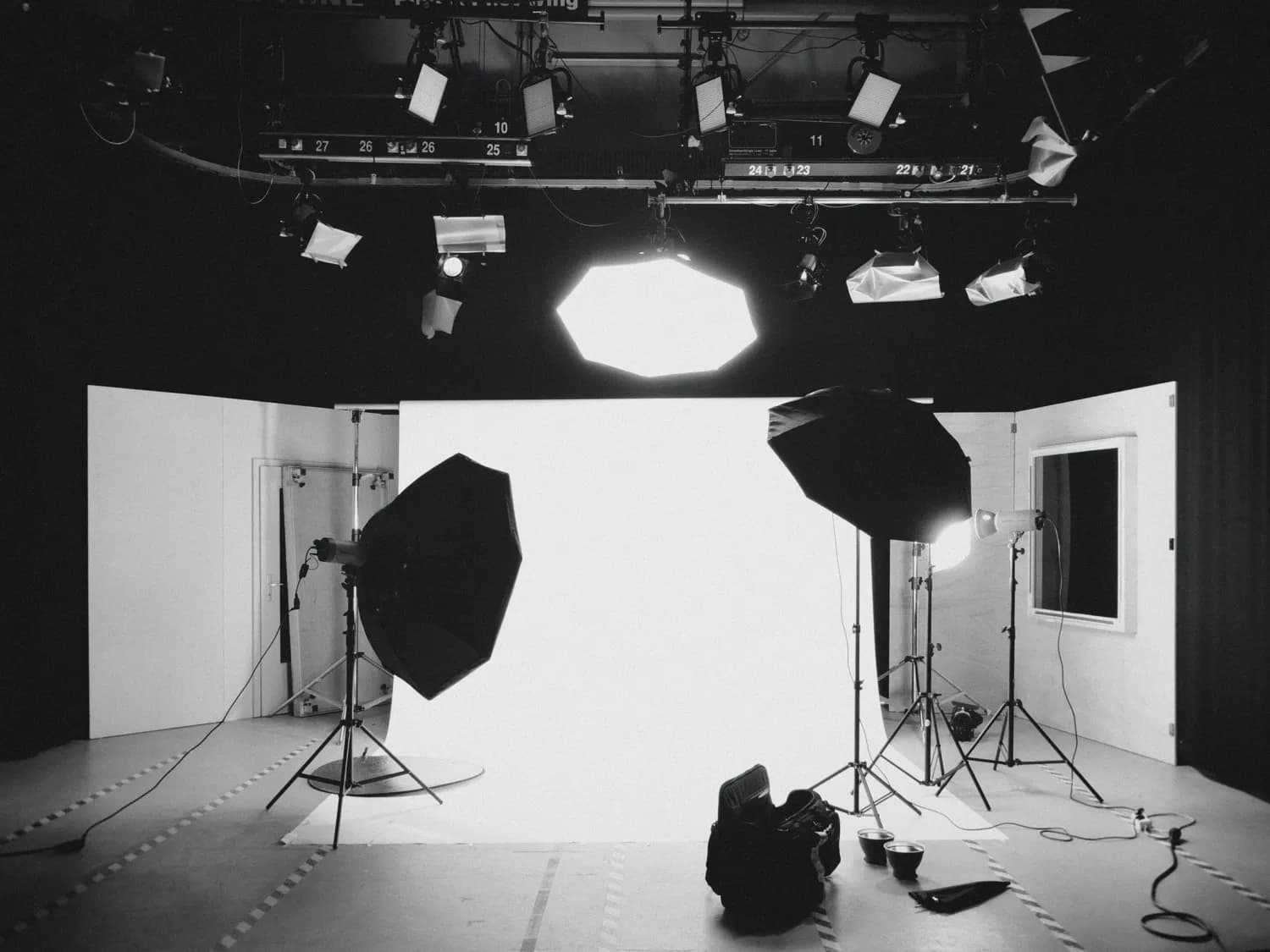 A photo studio set with lights and a backdrop