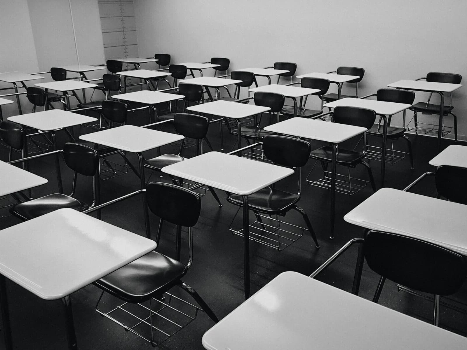 Rows of desks in an empty classroom